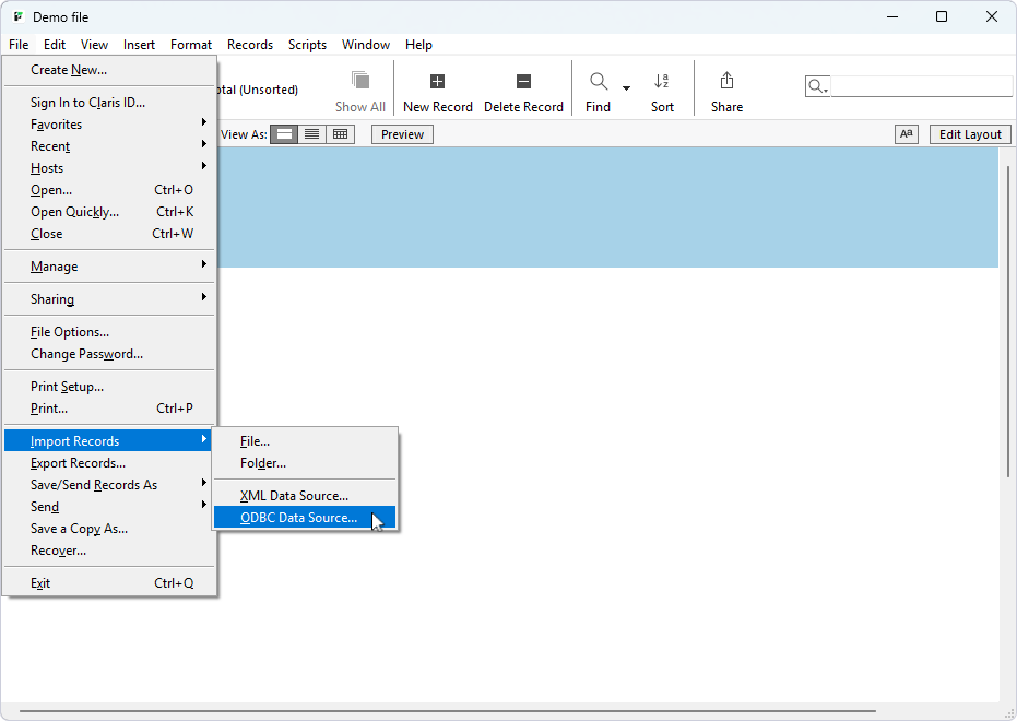 An opened file in FileMaker Pro with the extended File menu and Import Records submenu